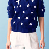 Suéter con mangas abullonadas y bordado de conchas