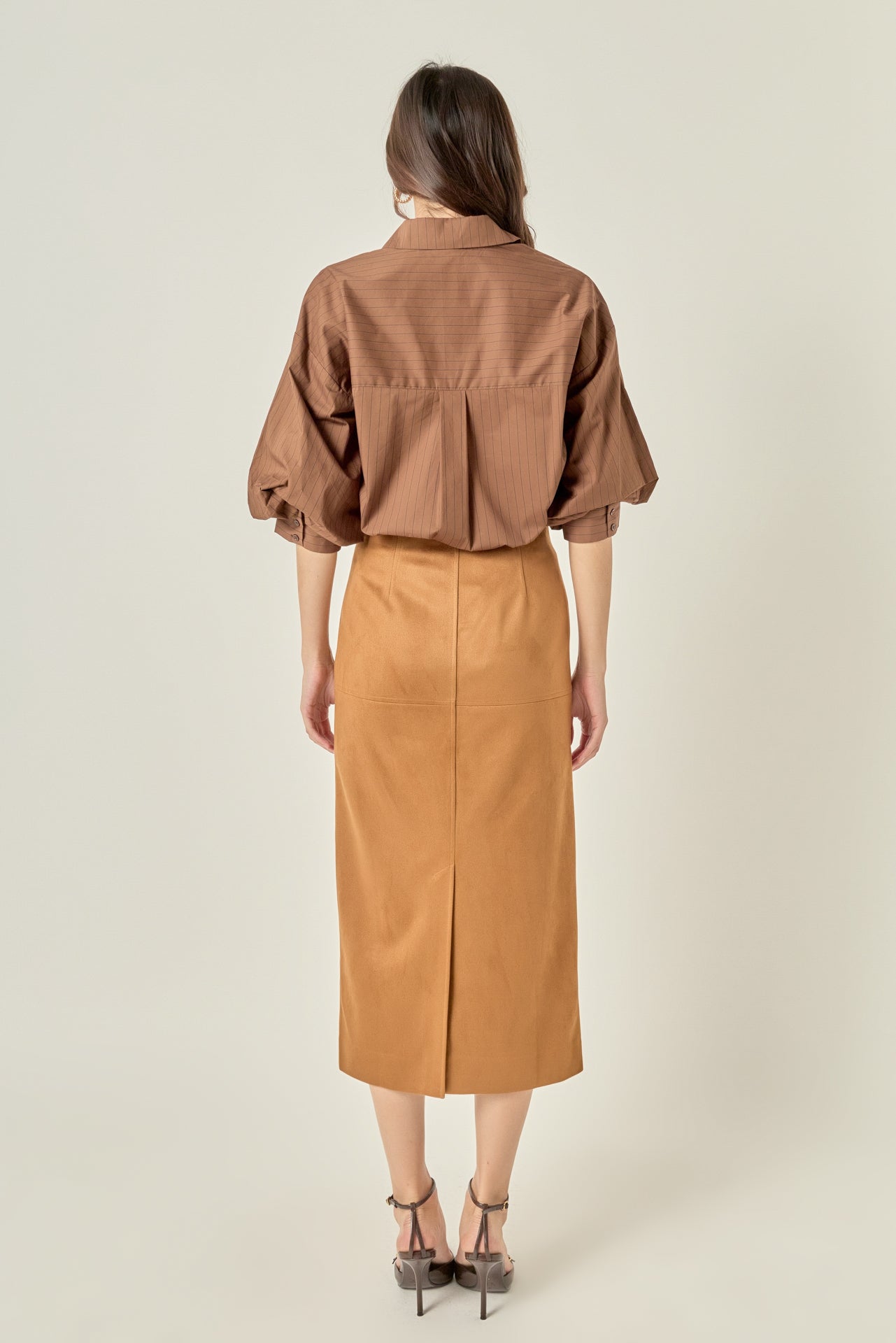 Full-length rear view of a brown pinstripe shirt displaying the back yoke detail and dramatic gathered balloon sleeves.